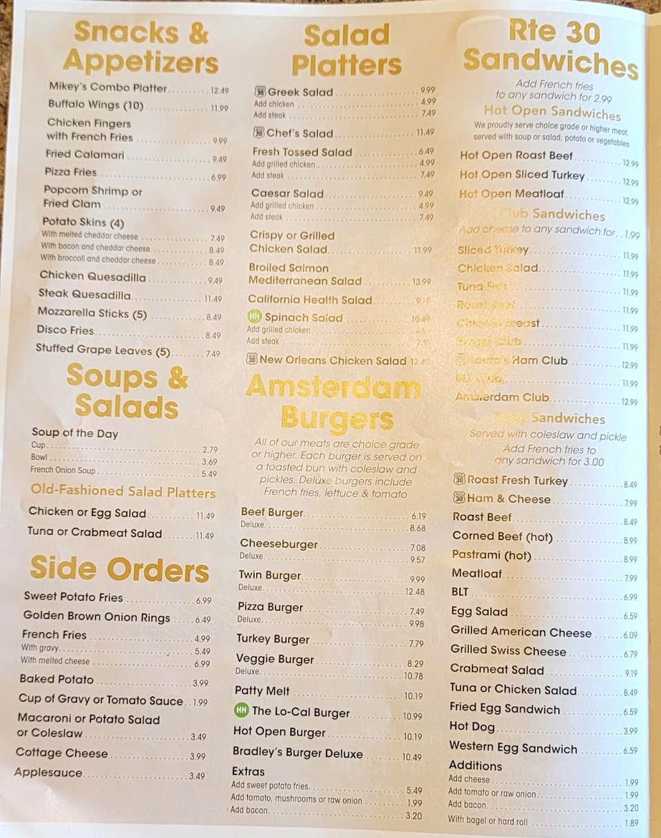Breakfast menu spread with coffee and toast.